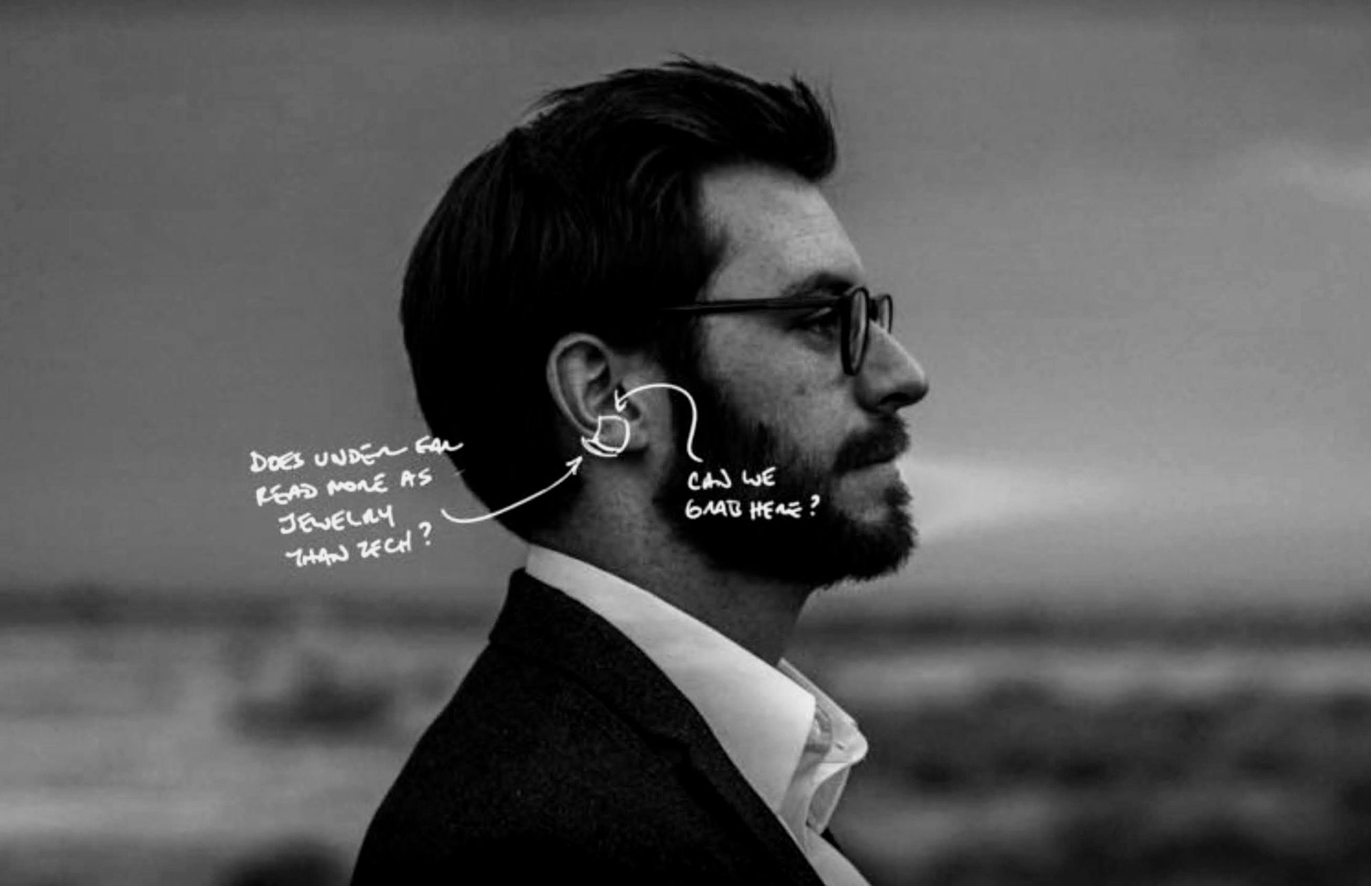 Annotated concept photo asking whether an under-ear wearable reads as jewelry rather than tech