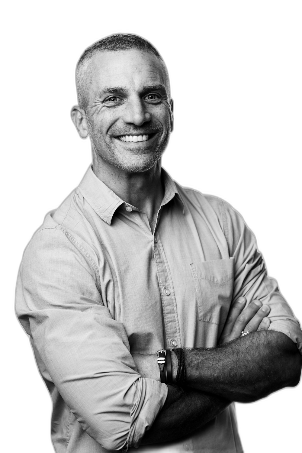 Portrait of Todd Reily, arms crossed, smiling